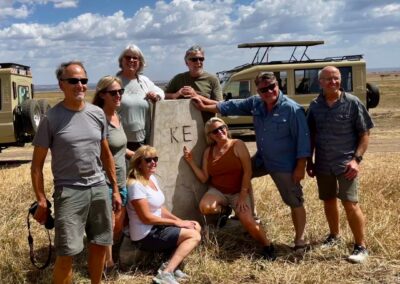 Safari guests in KE (Kenya) border landmark